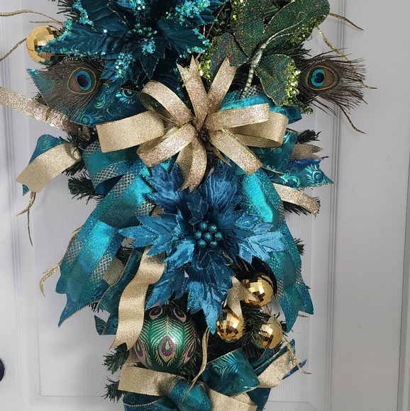 Gold and Teal Peacock Christmas Swag with Ornaments and a Butterfly.